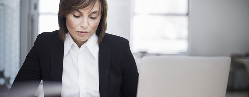 Senior finance executive working at her desk